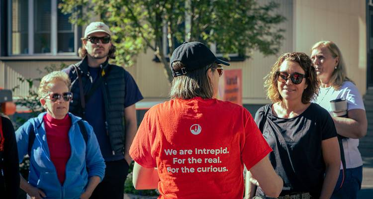 Tour group with guide in a city environment.