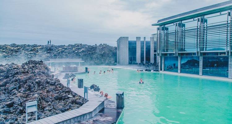 People enjoying the warm water at Blue Lagoon.