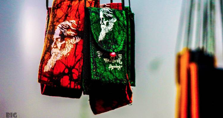Colorful hanging bags with artistic prints.