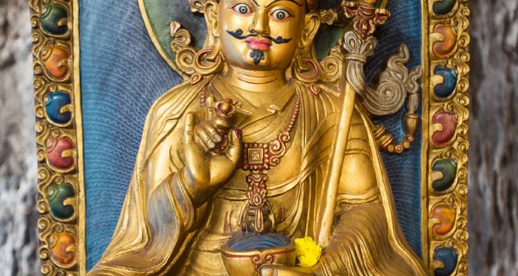 Colorful statue of a deity with intricate details.