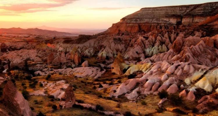 Rocky landscape with unique geological formations during sunset.