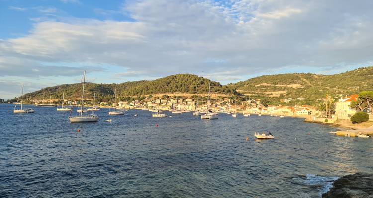 Coastal town with boats in harbor.