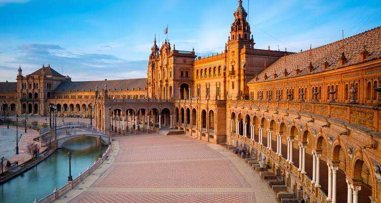 Iconic architectural square with arches and canal.