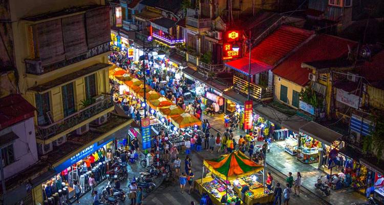 Vibrant overhead view of a bustling night market.