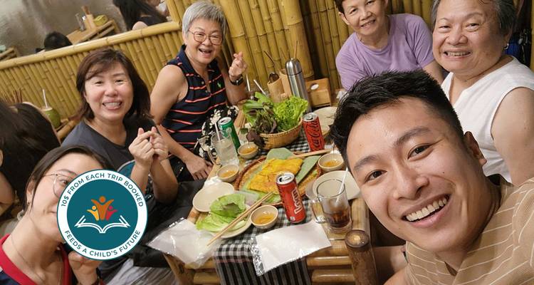 Group of people enjoying a meal at a table.