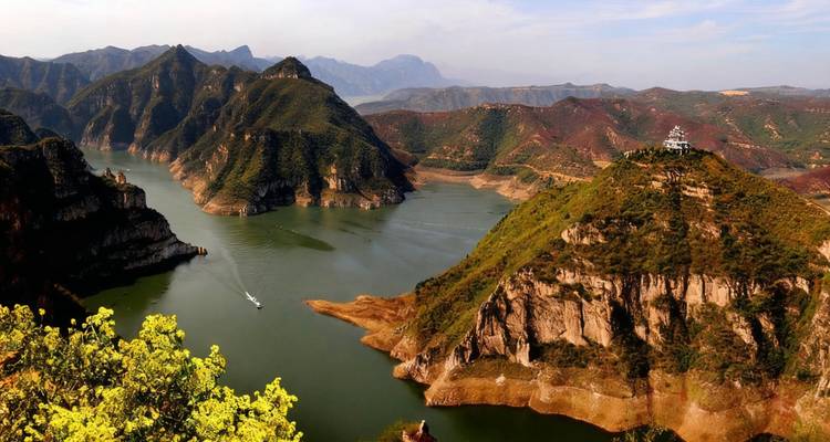 Scenic view of a river winding through mountainous terrain.