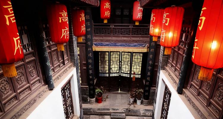 Traditional Chinese courtyard with red lanterns.