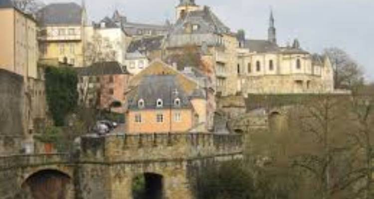 Blurred image of a historic landscape with buildings.