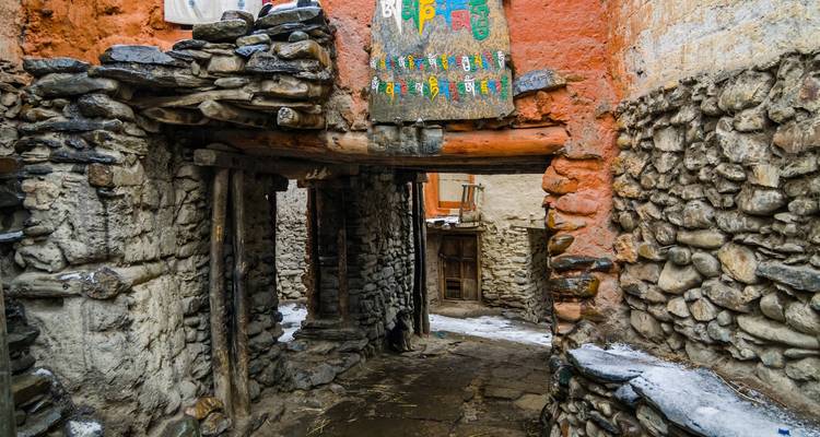 Traditional stone buildings in a narrow alley.
