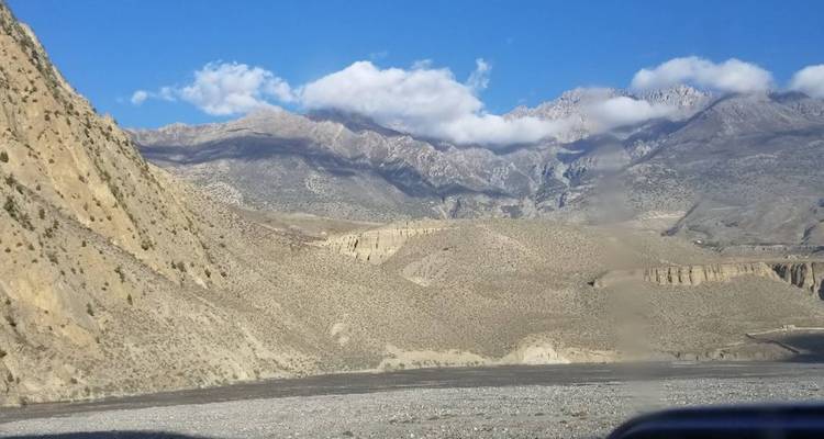Arid landscape with mountains in the background.