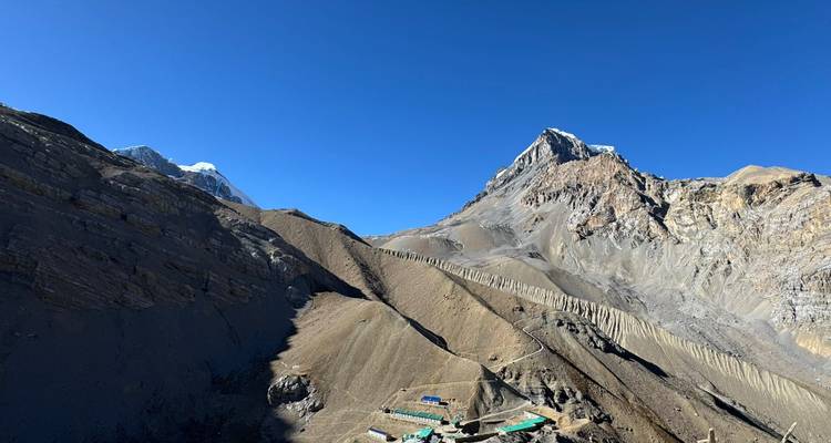 Snow-capped peaks and rugged terrain.