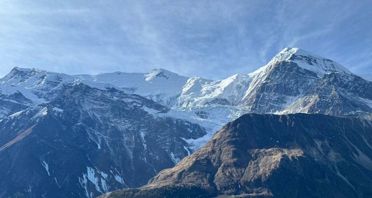 Panoramic view of snow-covered mountains.