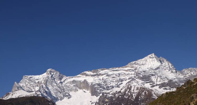 Mountain range with clear blue sky.