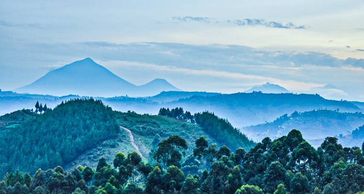 Hilly landscape with mountains in the distance.