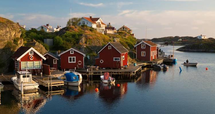 Colorful coastal village with small houses by the water.