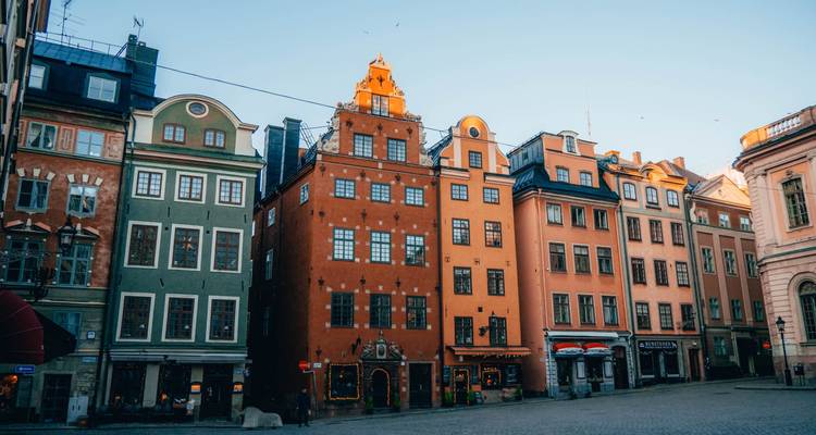 Colorful historical buildings in a city square.