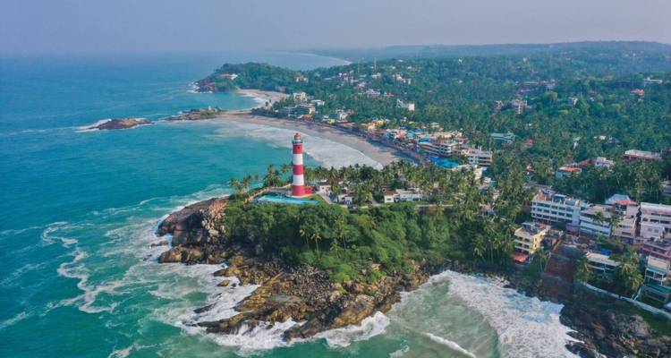 Aerial view of a coastal area with a lighthouse.