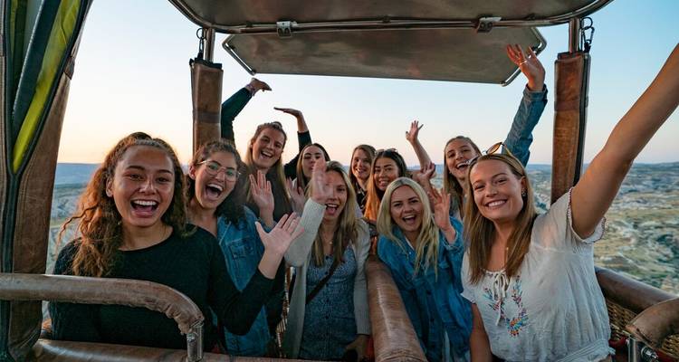 Group of people in a hot air balloon.