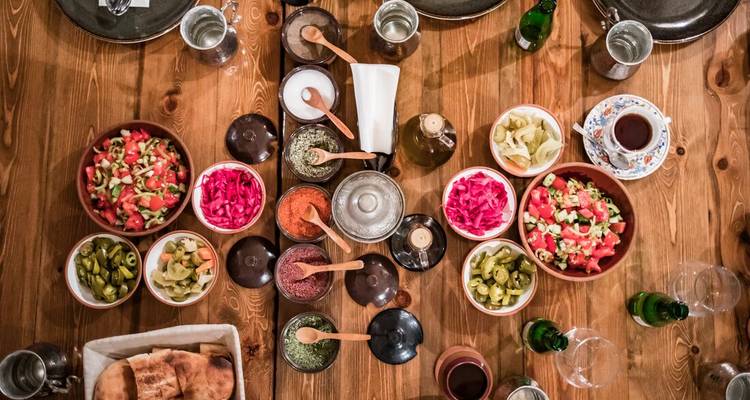 Table with various traditional dishes.