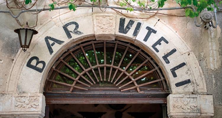 Entrance of Bar Vitelli with vintage architectural details.