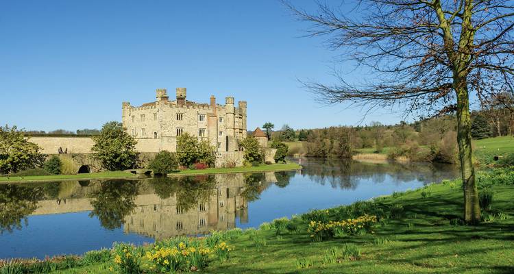 Castle with reflection on a still lake.