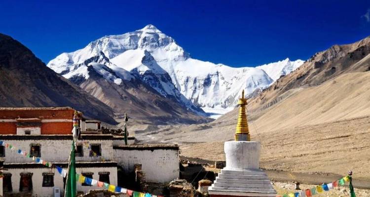 Panoramic view of Everest with a stupa in the foreground.