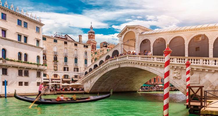 Famous canal with gondolas in a historic city.
