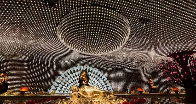 Interior of a beautifully decorated dome with intricate patterns.
