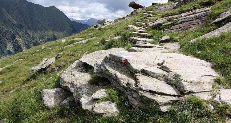 Rocky hiking trail in a mountainous area.