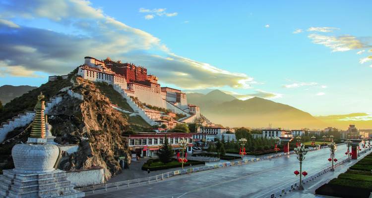 Historic palace on a hill during sunrise.