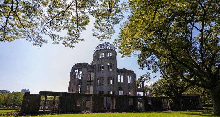 The Hiroshima Peace Memorial against a blue sky.