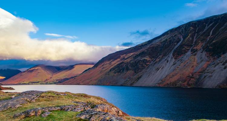 Scenic view of a lake with mountains in the background.