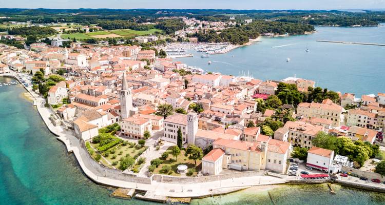 Aerial view of a coastal city with a marina.