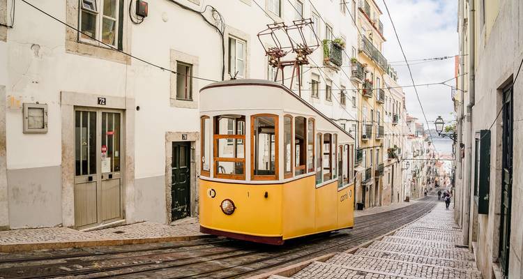 Traditional tram navigating a steep street.