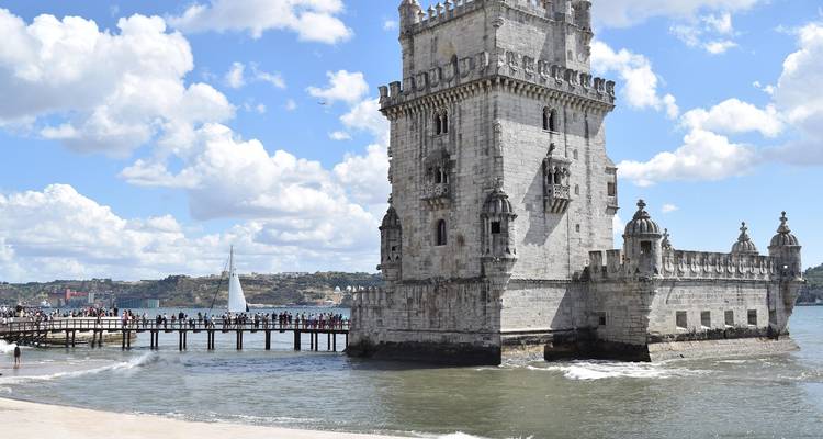 Belém Tower surrounded by water.