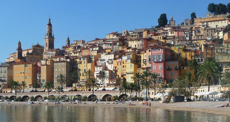 Colorful houses on a hillside by the coast.