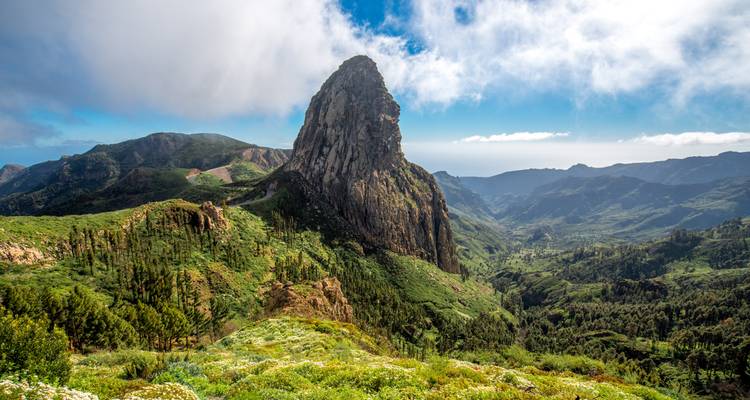 Scenic view of a rocky peak in a mountainous landscape.