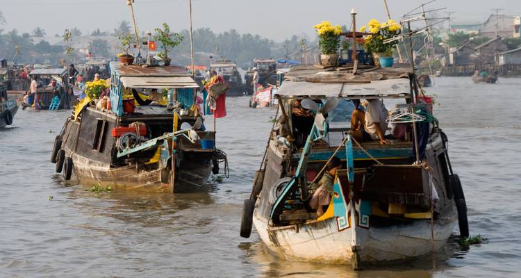 Floating market with boats loaded with goods.
