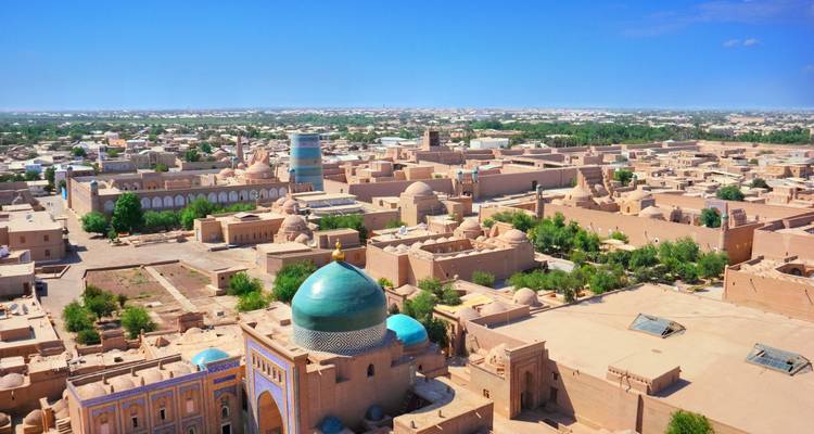 Aerial view of ancient cityscape with domes and mosques.