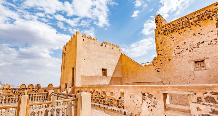 A historic fort with stunning ancient architecture under a bright blue sky.