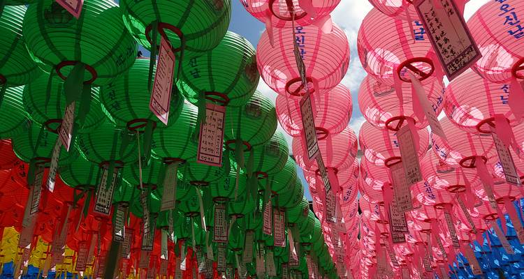 Colorful traditional lanterns hanging in rows.