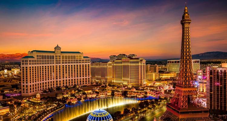 A vibrant sunset view of the Las Vegas Strip with iconic hotels.