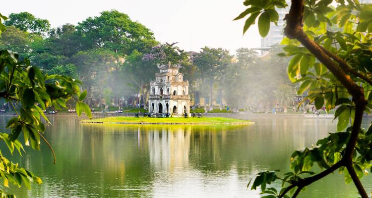 Pagoda on an island in a serene urban park.