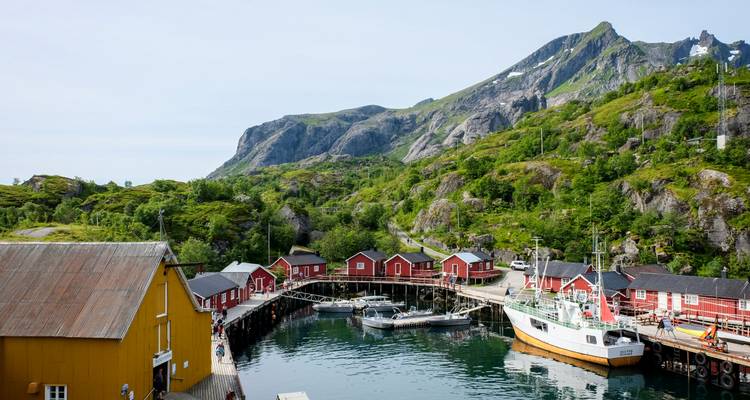 Coastal village with colorful buildings and boats.