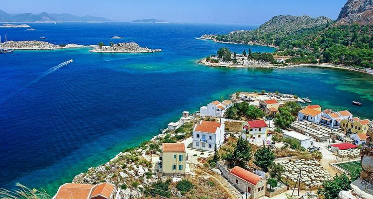 Colorful coastal village with turquoise waters.