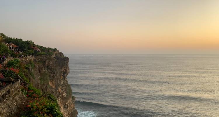Sunset over a cliffside with ocean views.