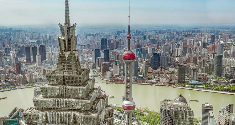 Urban skyline of Shanghai with iconic skyscrapers.