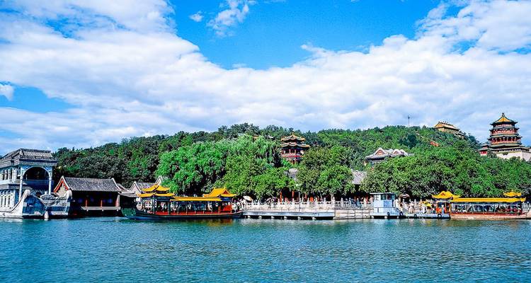 A scenic view of the Summer Palace with traditional Chinese architecture along a waterfront.