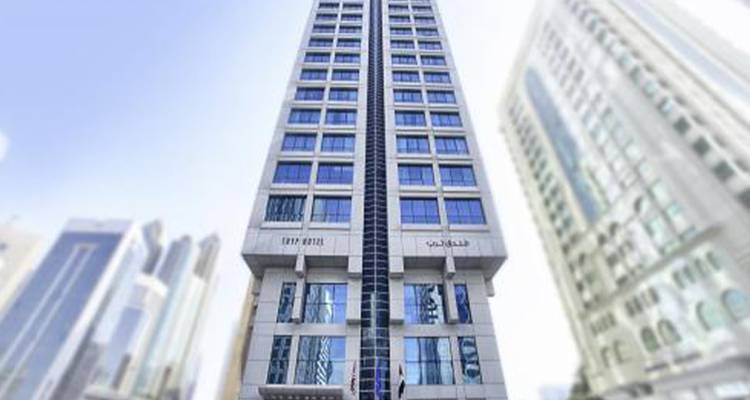 Tall hotel building with a modern facade.