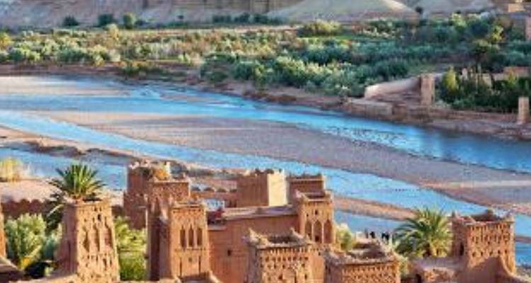 Historic fortified village by a river.